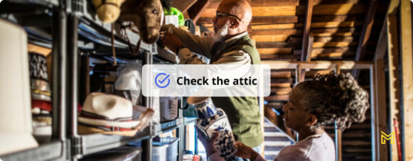 Senior couple organizing items in home attic