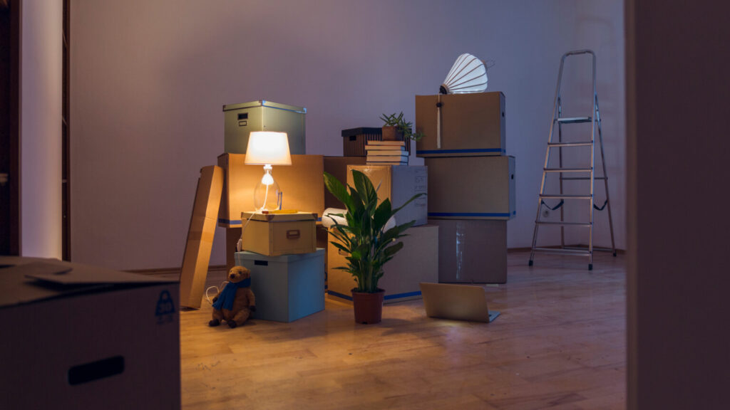 Cardboard boxes in an empty room in a new home