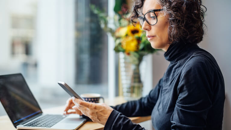 Mature businesswoman at cafe