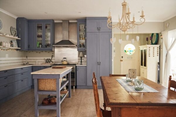 Country style kitchen with a sofa table used as an island